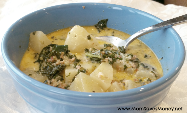 Tuscan sausage and potato soup served in a blue bowl