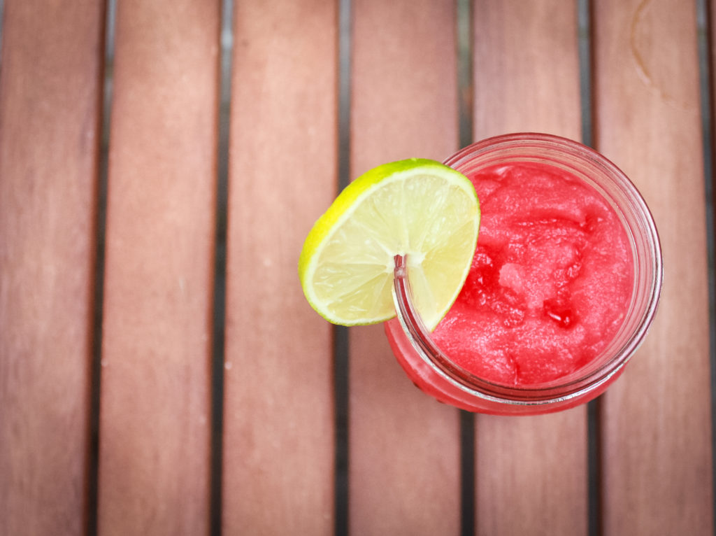 watermelon slush in glass cup on table