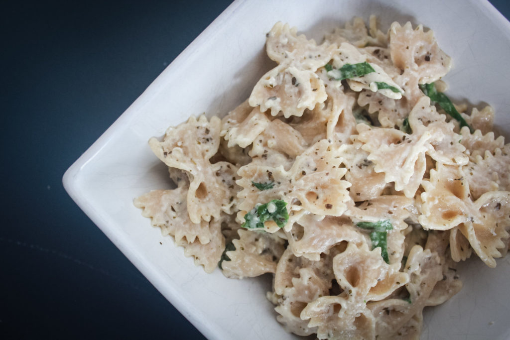 basil chicken alfredo in white bowl