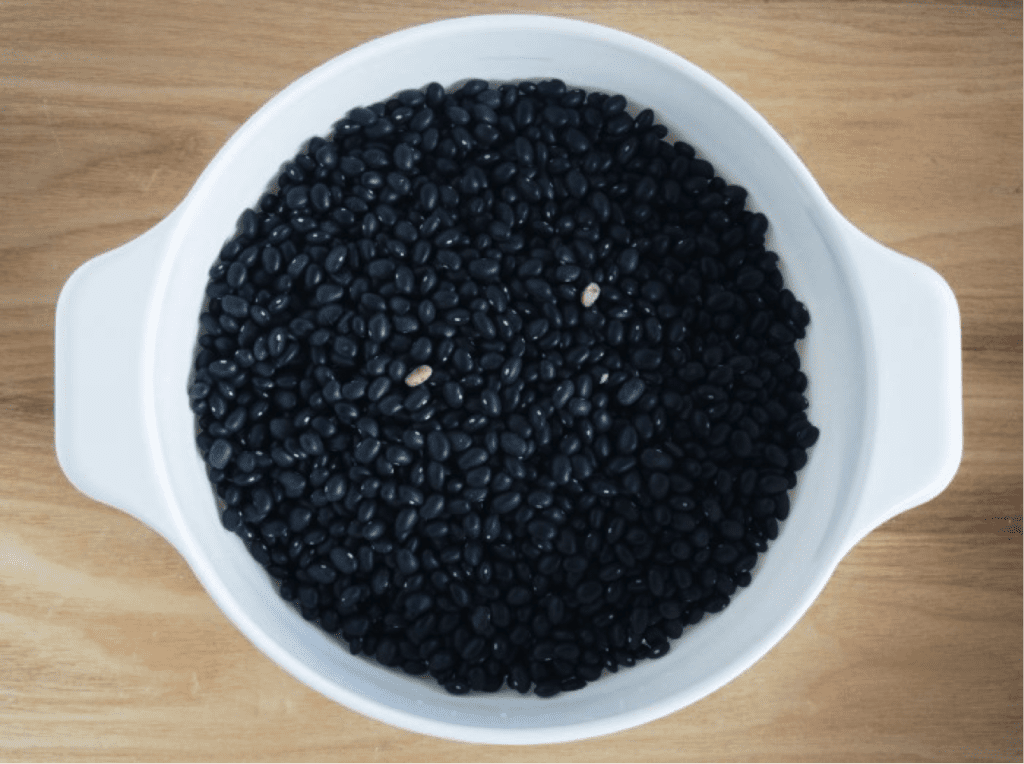 Black beans in white bowl