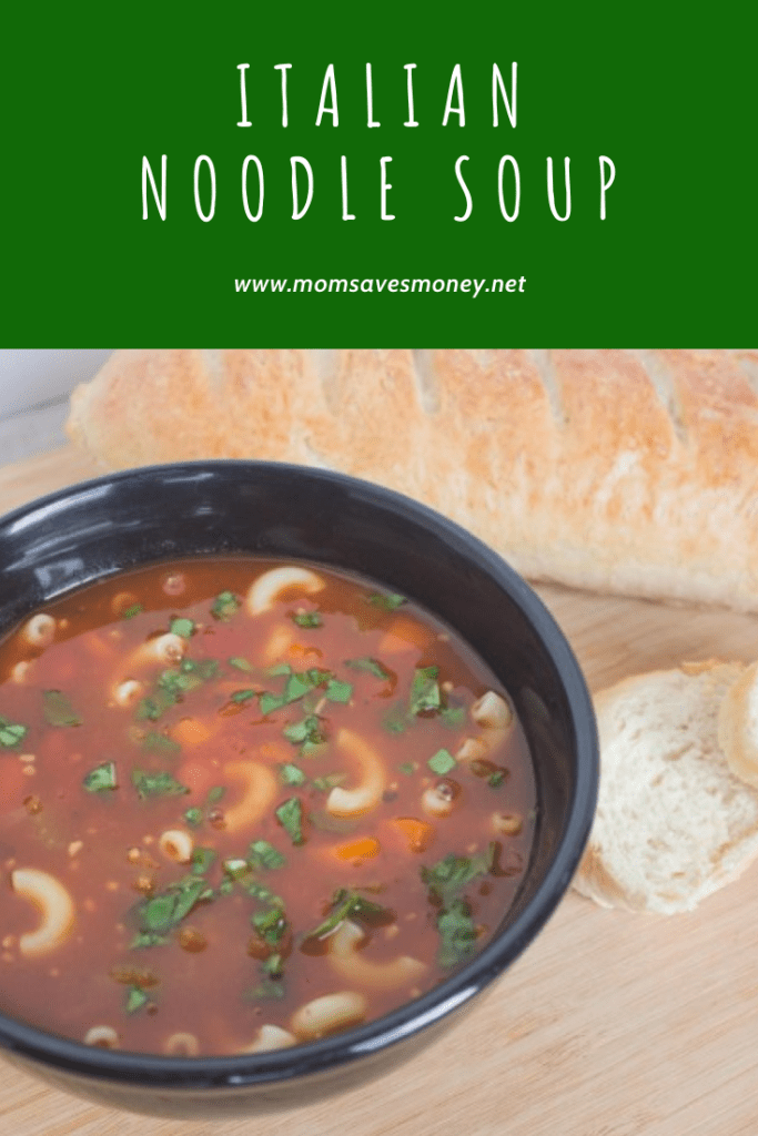 Italian noodle soup in bowl with french bread