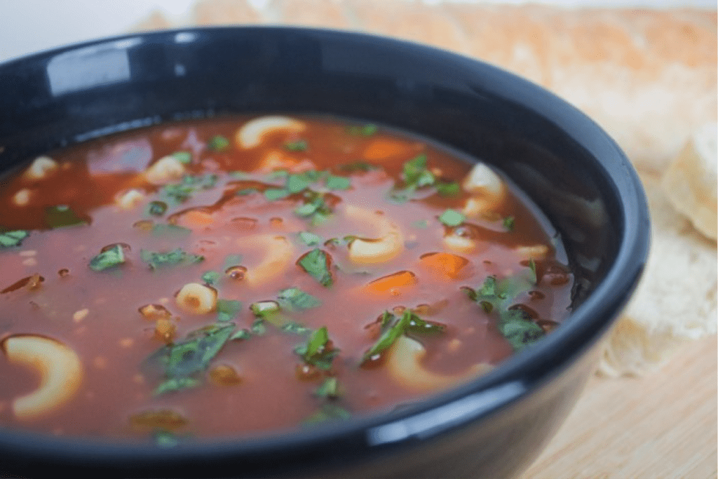 Italian noodle soup in bowl 