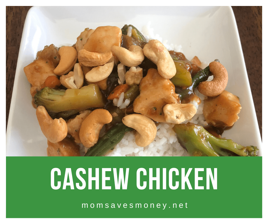 Cashew chicken over rice in a white bowl