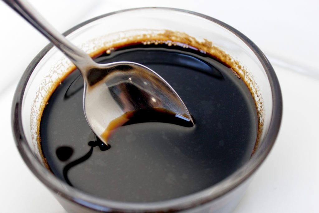 balsamic glaze in bowl with spoon