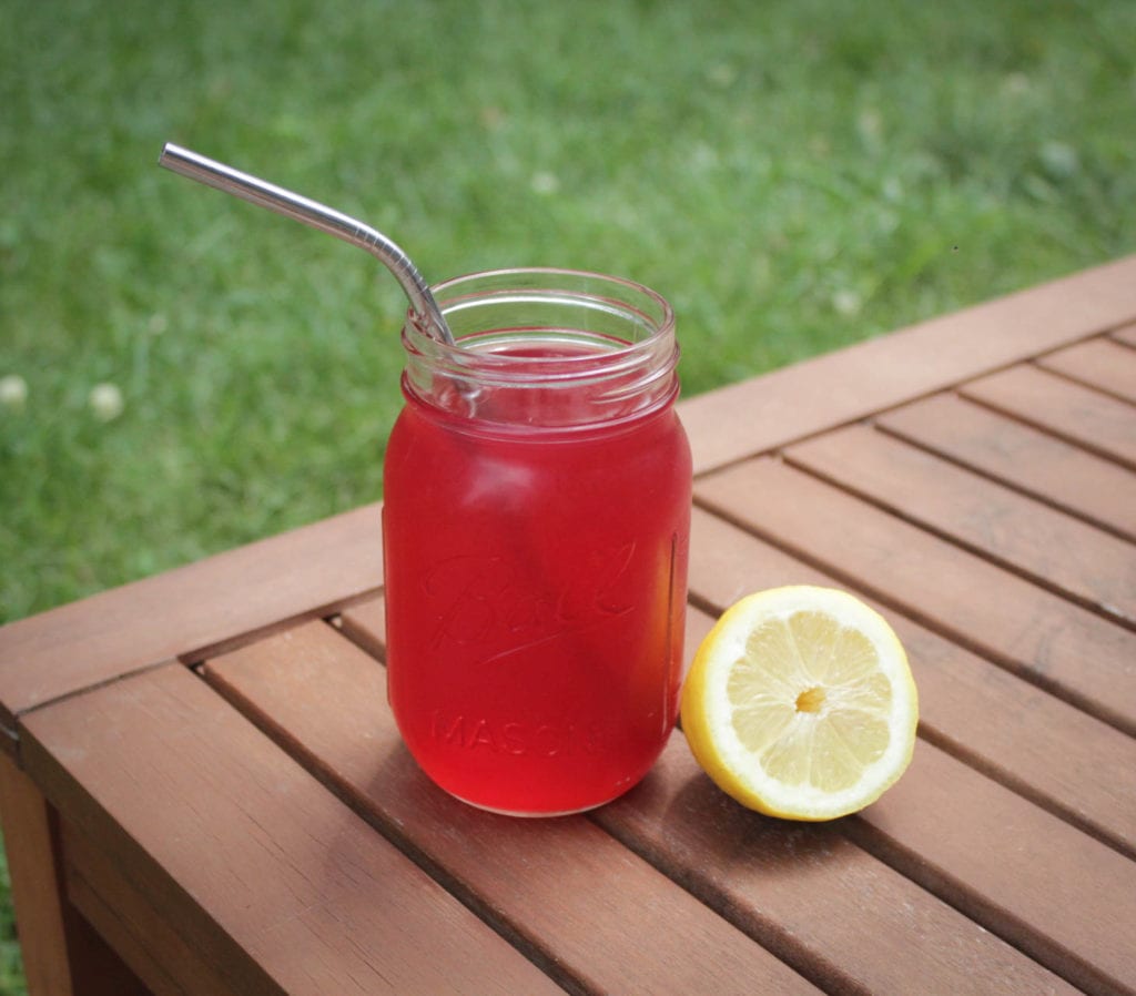 passion tea lemonade in glass on deck