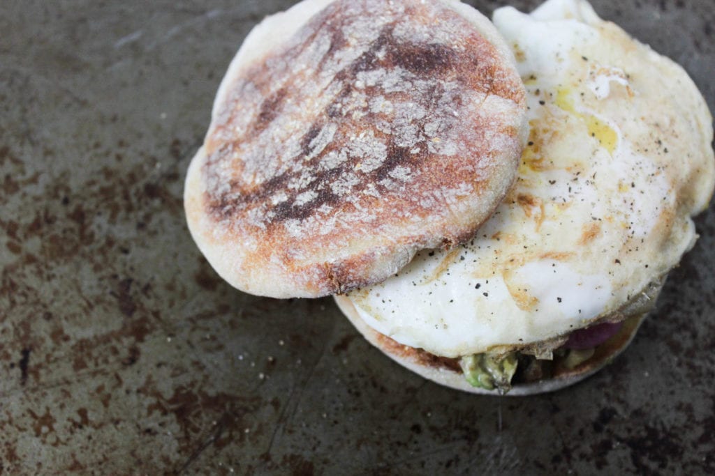 avocado & egg breakfast sandwich on a toasted English muffin