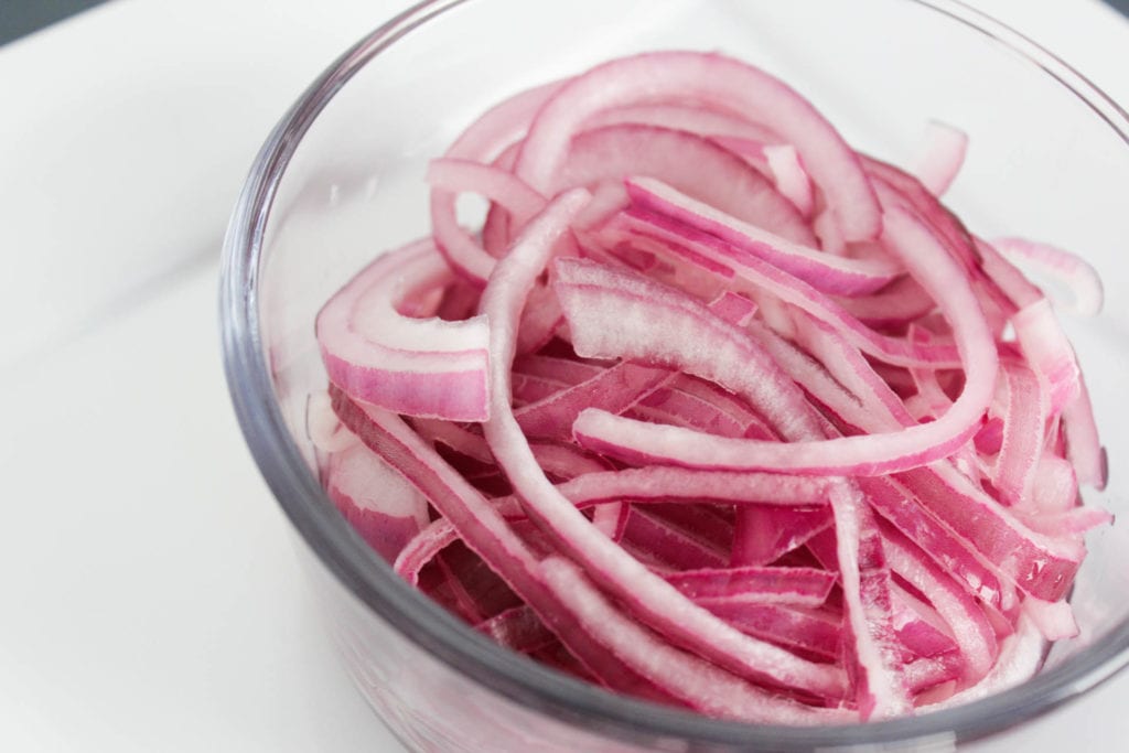 pickled onions in a glass bowl