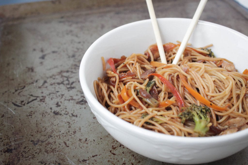 Incredibly easy Asian noodle stir fry recipe made with fresh vegetables, including bell peppers, broccoli and carrots, a flavorful stir fry sauce and mixed with spaghetti noodles. 