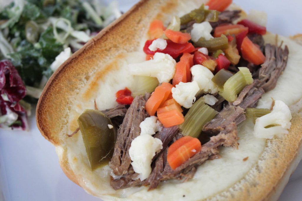 Hot Italian beef sandwiches with provolone cheese and Giardiniera