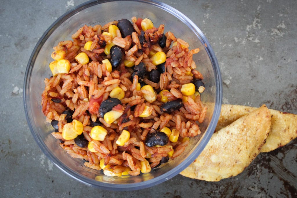 Homemade spanish rice with a blend of flavorful seasonings, corn, tomatoes, diced green chiles and black beans. Serve with your favorite Mexican dishes