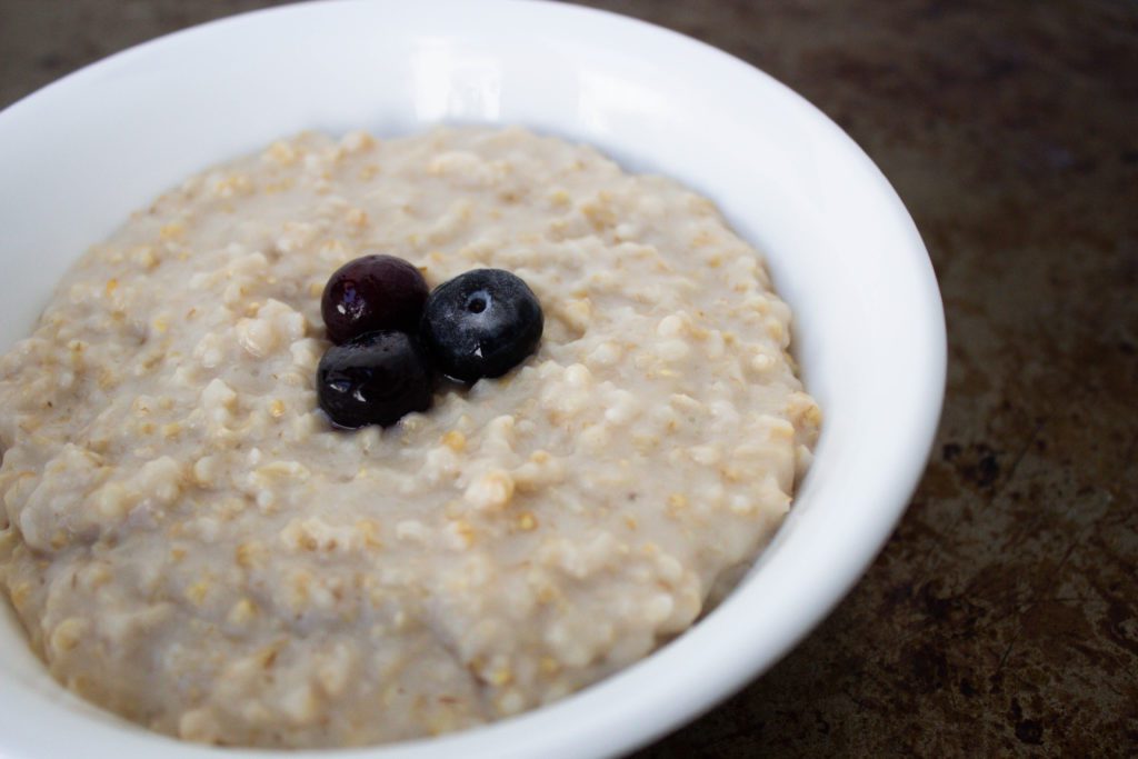 pressure cooked steel cut oats in a white bowl