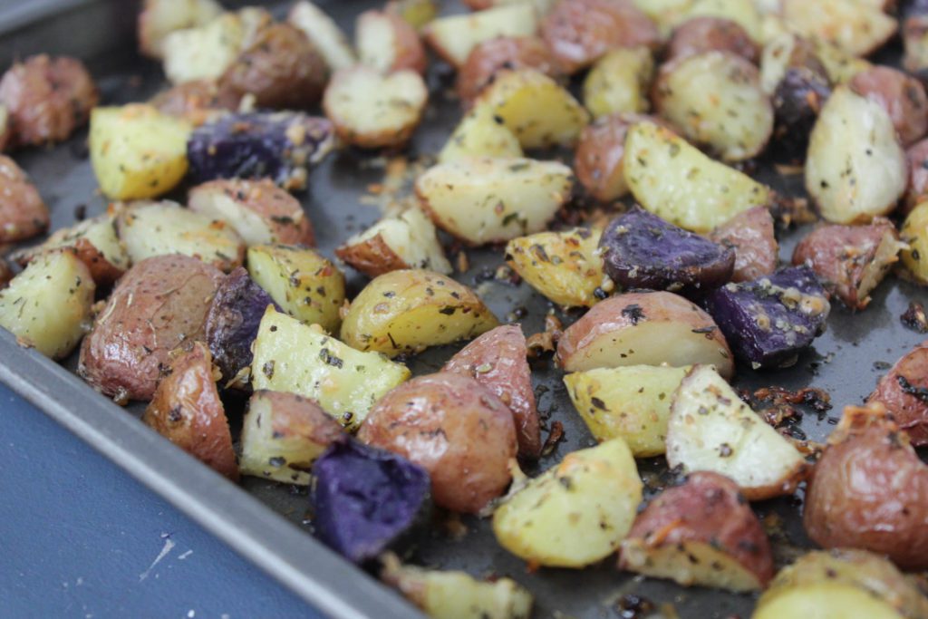 Roasted baby potatoes on a baking sheet