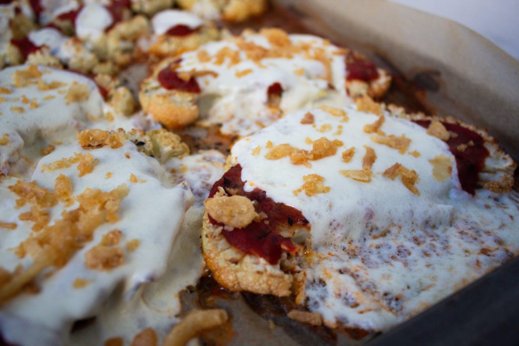 cauliflower parmesan on a baking sheet