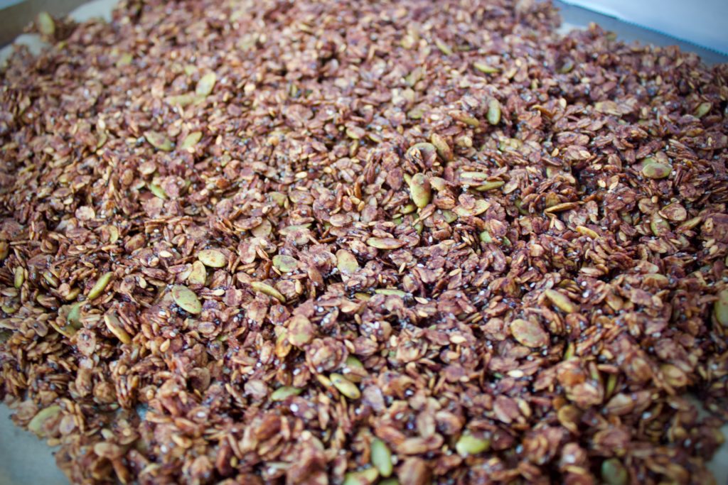 Homemade chocolate granola on a baking sheet