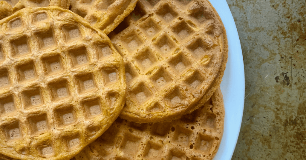 Sweet potato waffles on a white plate