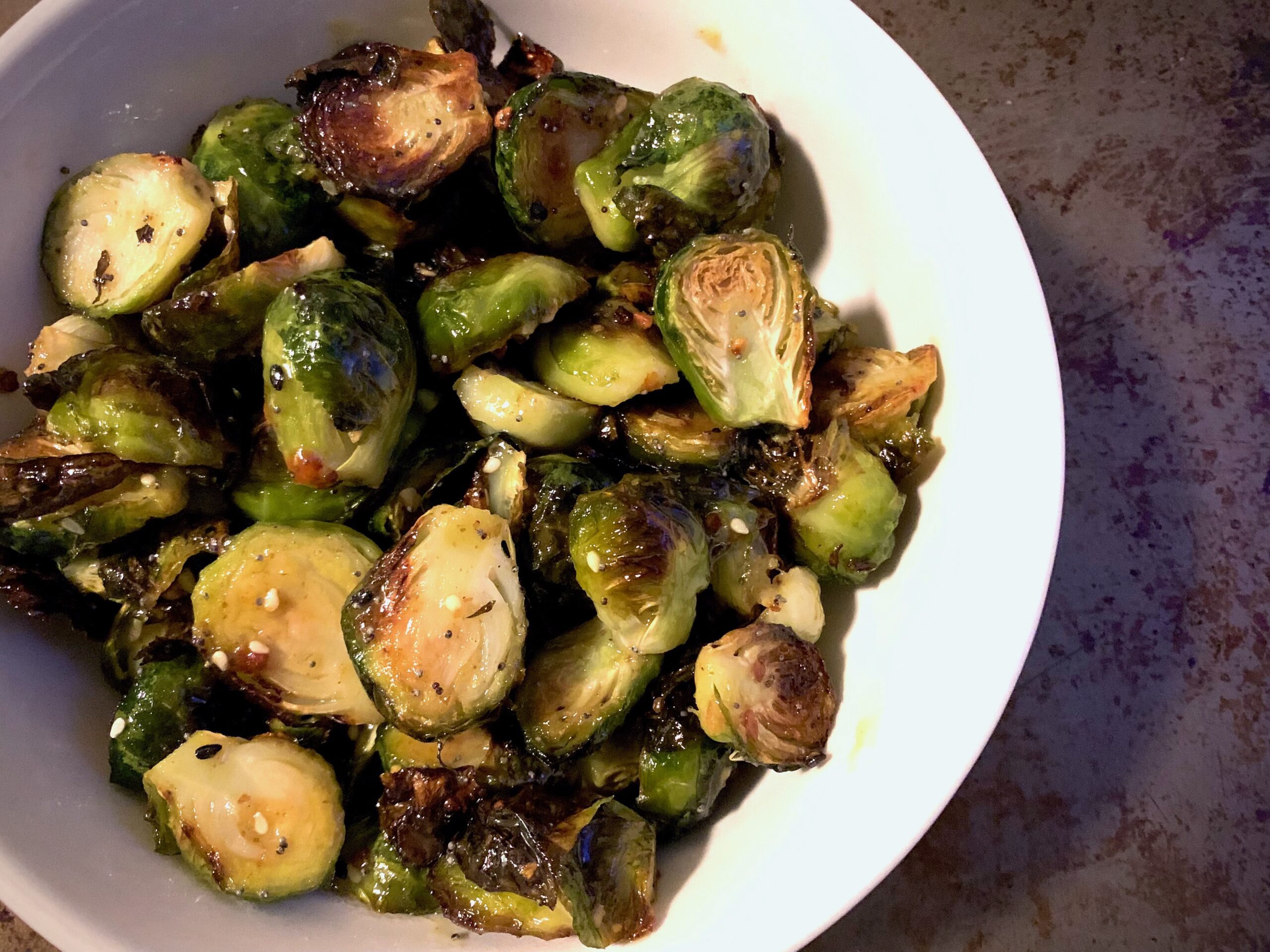 Roasted honey mustard brussels sprouts in a white bowl