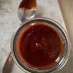 homemade bbq sauce in glass jar with spoon