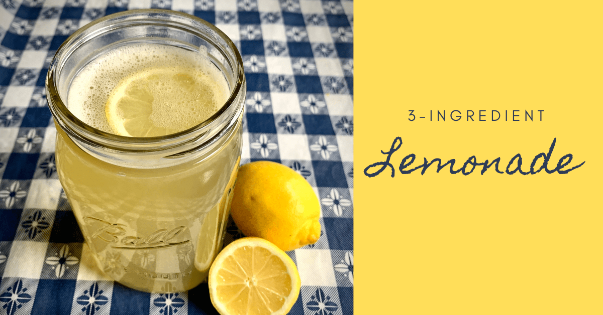 3-ingredient lemonade with image of lemonade in ball jar on a blue and white checkered tablecloth with lemons on table